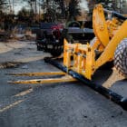 Utility Construction Fork for sale Carrying a Pipe - Rockland Manufacturing